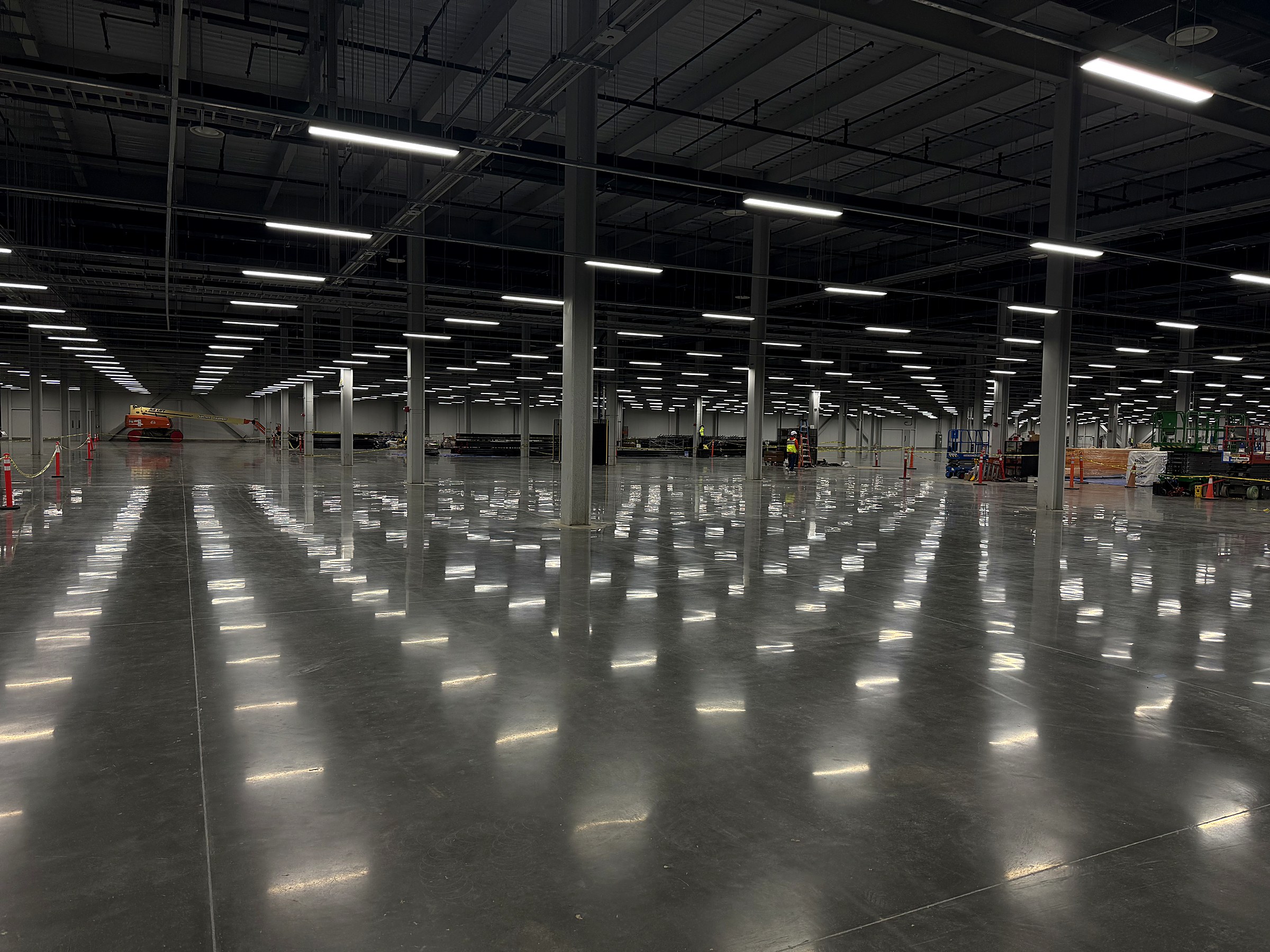 ICF industrial epoxy flooring installation inside a large manufacturing facility